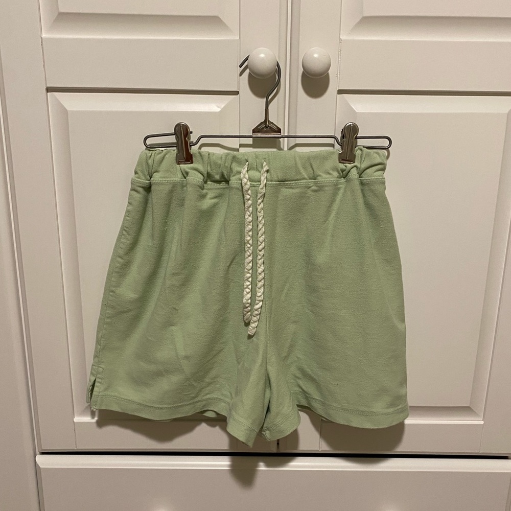 light green sweat shorts
